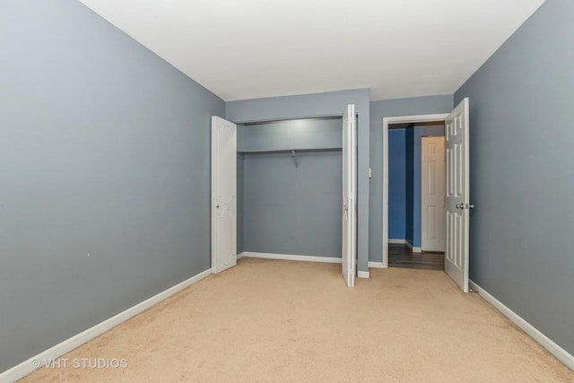 4137 W 97th Pl Unit 311, Oak Lawn, IL 60453 - unfurnished bedroom featuring light carpet, baseboards, and a closet