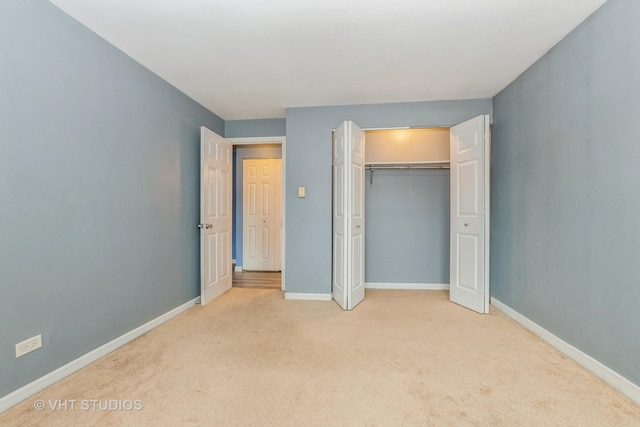 4137 W 97th Pl Unit 311, Oak Lawn, IL 60453 - unfurnished bedroom featuring light colored carpet, baseboards, and a closet