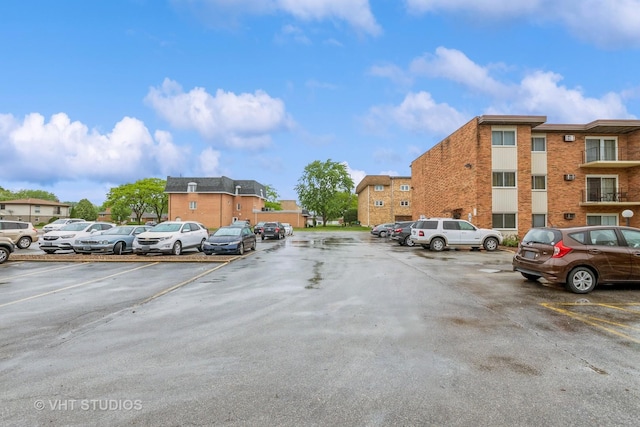 4137 W 97th Pl Unit 311, Oak Lawn, IL 60453 - uncovered parking lot with a residential view