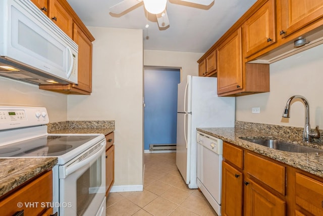 4137 W 97th Pl Unit 311, Oak Lawn, IL 60453 - kitchen featuring white appliances, a sink, ceiling fan, brown cabinetry, and baseboard heating