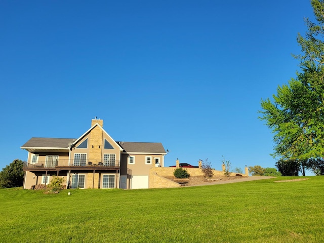 7648 N Indian Ridge Rd, East Dubuque, IL 61025 - rear view of house with a lawn, a chimney, and a deck