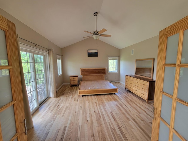 7648 N Indian Ridge Rd, East Dubuque, IL 61025 - bedroom with access to outside, light wood-style flooring, vaulted ceiling, baseboards, and a ceiling fan