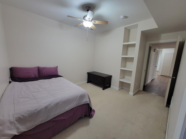 7648 N Indian Ridge Rd, East Dubuque, IL 61025 - bedroom with light colored carpet, baseboards, and a ceiling fan