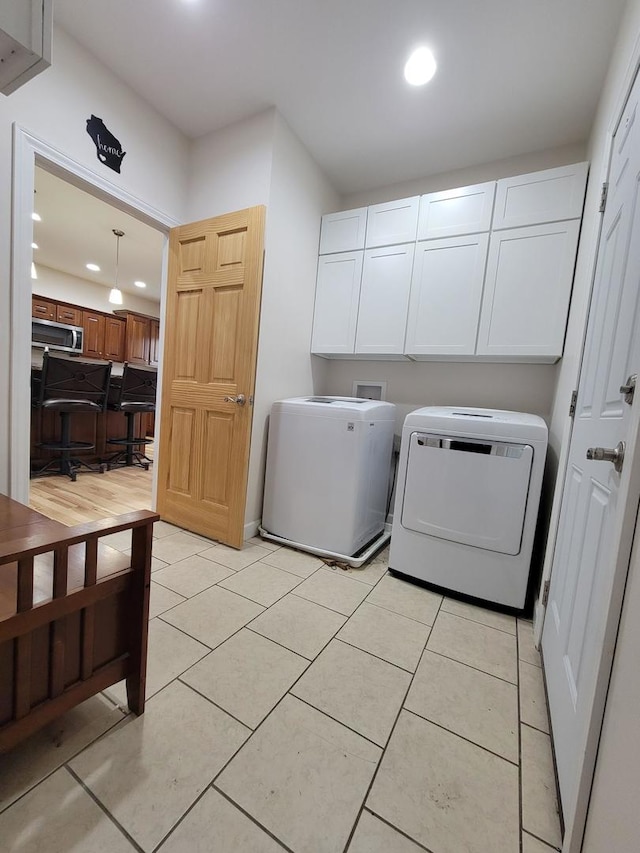 7648 N Indian Ridge Rd, East Dubuque, IL 61025 - washroom featuring cabinet space, recessed lighting, hookup for a washing machine, and light tile patterned flooring