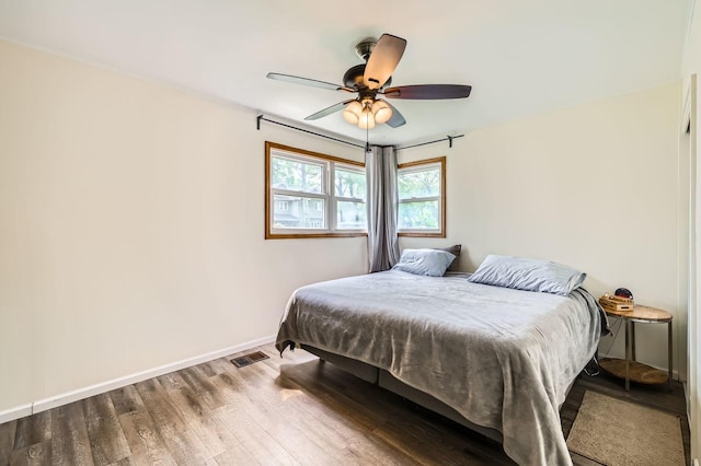 3007 Falcon Ct W, Rolling Meadows, IL 60008 - bedroom with wood finished floors, baseboards, and ceiling fan