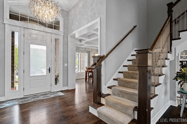4336 Winterberry Ave, Naperville, IL 60564 - entrance foyer featuring a chandelier, baseboards, dark wood-style flooring, coffered ceiling, and beam ceiling