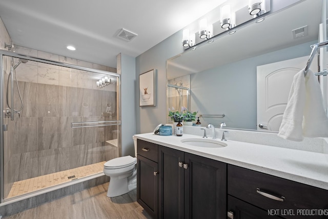 4336 Winterberry Ave, Naperville, IL 60564 - bathroom featuring vanity, toilet, a stall shower, and wood finished floors