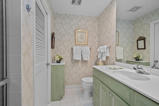 140 Franklin Pl Unit 106, Lake Forest, IL 60045 - bathroom with a closet, tile patterned floors, toilet, and vanity
