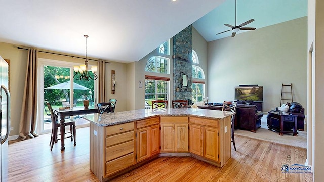 532 Nunda Trl, Crystal Lake, IL 60012 - kitchen with light wood-style floors, open floor plan, a chandelier, high vaulted ceiling, and pendant lighting
