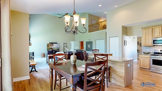 532 Nunda Trl, Crystal Lake, IL 60012 - dining room with a chandelier, a high ceiling, light wood-type flooring, baseboards, and recessed lighting