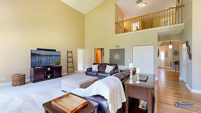 532 Nunda Trl, Crystal Lake, IL 60012 - living room featuring high vaulted ceiling, baseboards, and wood finished floors