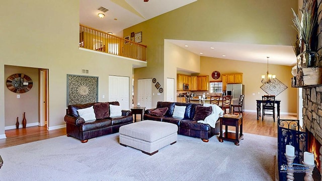 532 Nunda Trl, Crystal Lake, IL 60012 - living room featuring high vaulted ceiling, light wood-type flooring, baseboards, and a chandelier