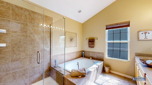 532 Nunda Trl, Crystal Lake, IL 60012 - bathroom featuring vaulted ceiling, a shower stall, a bath, vanity, and baseboards