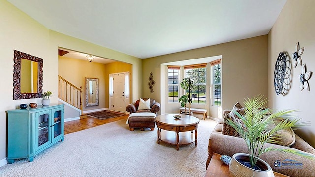 532 Nunda Trl, Crystal Lake, IL 60012 - living room featuring stairs, baseboards, carpet floors, and wood finished floors