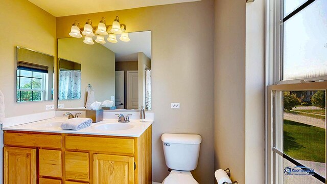 532 Nunda Trl, Crystal Lake, IL 60012 - full bath with healthy amount of natural light, toilet, double vanity, and a chandelier