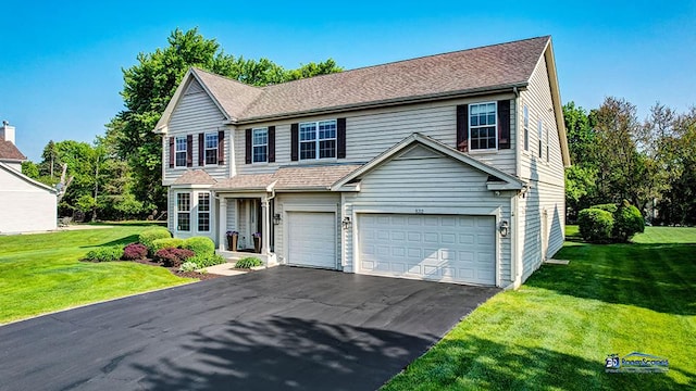 532 Nunda Trl, Crystal Lake, IL 60012 - traditional-style house featuring an attached garage, asphalt driveway, and a front yard