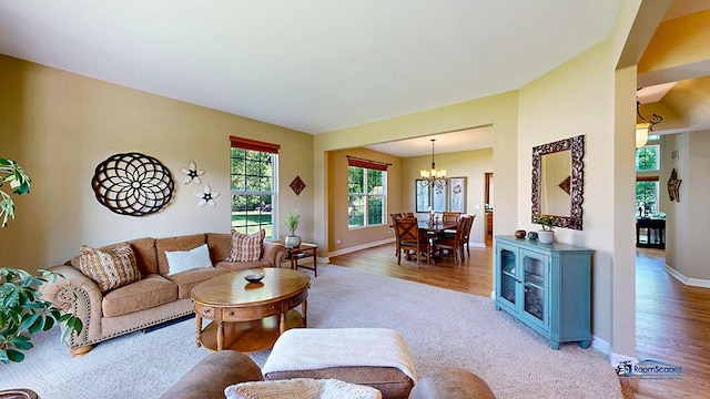 532 Nunda Trl, Crystal Lake, IL 60012 - living room with a chandelier, baseboards, and wood finished floors