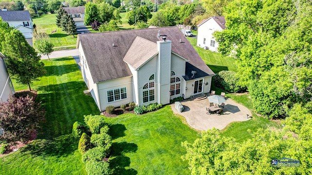 532 Nunda Trl, Crystal Lake, IL 60012 - rear view of property with a patio area, a chimney, and a yard
