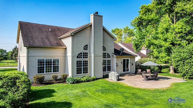 532 Nunda Trl, Crystal Lake, IL 60012 - rear view of property with a chimney, a patio, a yard, and a shingled roof
