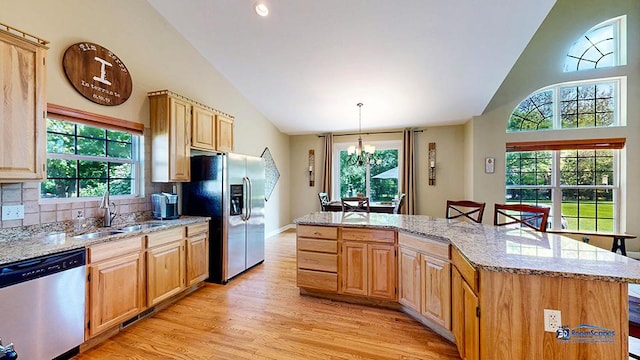 532 Nunda Trl, Crystal Lake, IL 60012 - kitchen featuring appliances with stainless steel finishes, a sink, plenty of natural light, light wood-type flooring, and high vaulted ceiling