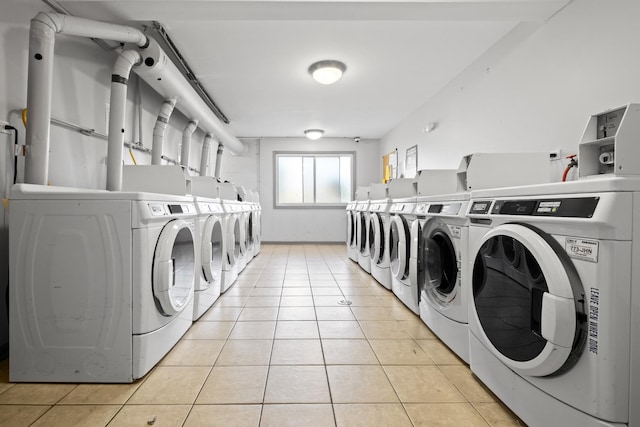 838 Jonathan Ct Unit 305, Prospect Heights, IL 60070 - shared laundry with washer and dryer and light tile patterned floors