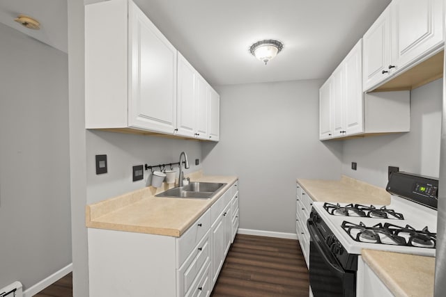 838 Jonathan Ct Unit 305, Prospect Heights, IL 60070 - kitchen featuring gas range, a sink, baseboard heating, baseboards, and dark wood-style flooring