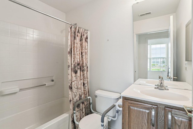 full bathroom featuring vanity, toilet, and shower / tub combo with curtain