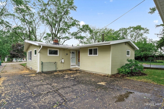 521 Division St, Saint Charles, IL 60174 - view of front of property with a chimney and driveway