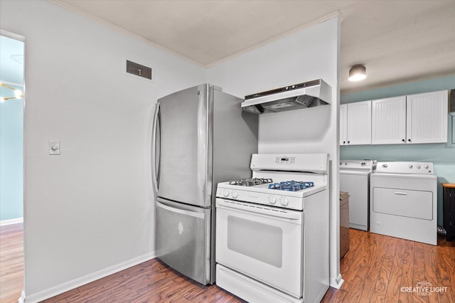 521 Division St, Saint Charles, IL 60174 - kitchen featuring white range with gas cooktop, washing machine and dryer, under cabinet range hood, ornamental molding, and wood finished floors