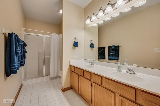 507 Parkland Ct, Oswego, IL 60543 - bathroom with a stall shower, tile patterned floors, toilet, double vanity, and baseboards