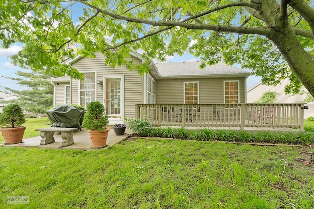 507 Parkland Ct, Oswego, IL 60543 - back of house featuring a patio, a yard, a wooden deck, and a shingled roof