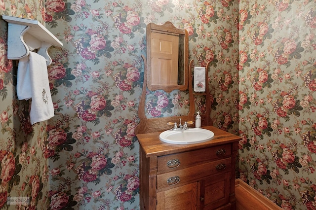 507 Parkland Ct, Oswego, IL 60543 - bathroom featuring wallpapered walls, vanity, and baseboards