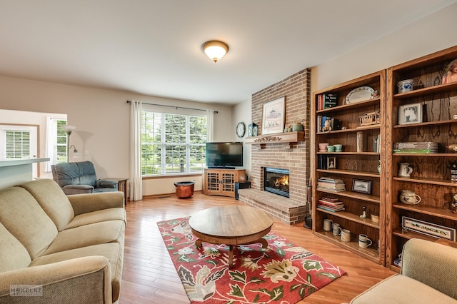 507 Parkland Ct, Oswego, IL 60543 - living room with a fireplace and light wood-type flooring