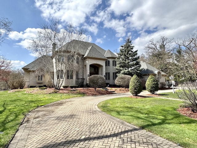 12400 S 88th Ave, Palos Park, IL 60464 - french provincial home with a front lawn, decorative driveway, and a chimney