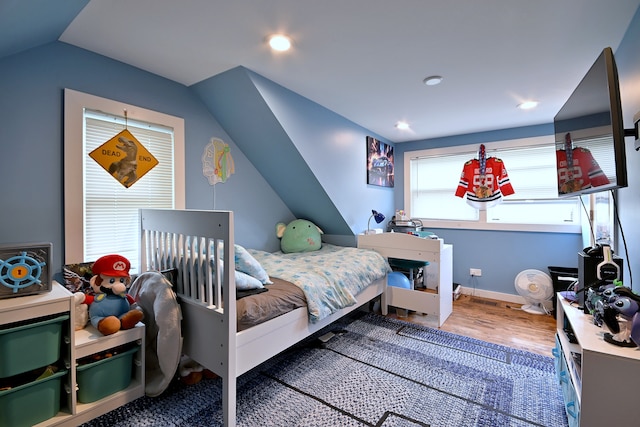 4200 Judd St, Schiller Park, IL 60176 - bedroom with lofted ceiling, wood finished floors, and baseboards