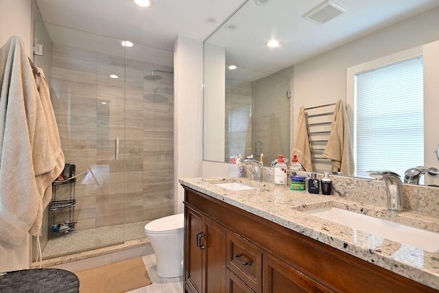 4200 Judd St, Schiller Park, IL 60176 - full bathroom featuring a stall shower, double vanity, toilet, and recessed lighting
