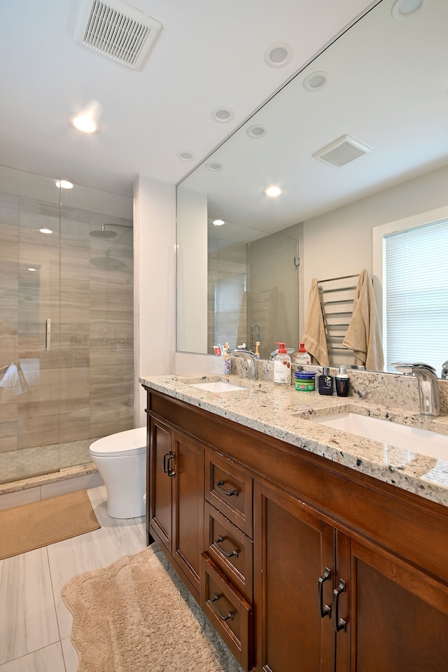 4200 Judd St, Schiller Park, IL 60176 - bathroom with a stall shower, double vanity, toilet, and recessed lighting