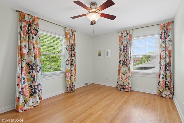 1702 Madsen Ct, Wheaton, IL 60187 - unfurnished room with light wood-type flooring, baseboards, and ceiling fan