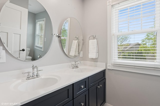 1702 Madsen Ct, Wheaton, IL 60187 - full bath featuring toilet, double vanity, and baseboards