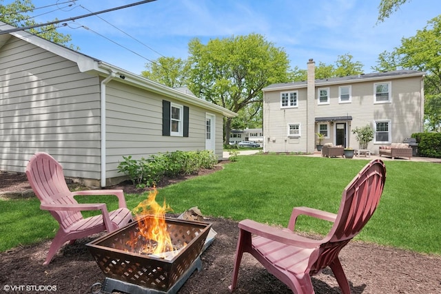 1702 Madsen Ct, Wheaton, IL 60187 - view of grassy yard featuring a fire pit