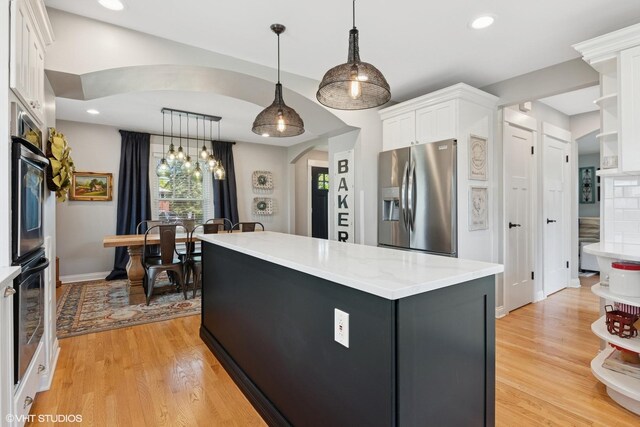 1702 Madsen Ct, Wheaton, IL 60187 - kitchen with stainless steel refrigerator with ice dispenser, white cabinetry, light wood-style floors, a center island, and recessed lighting