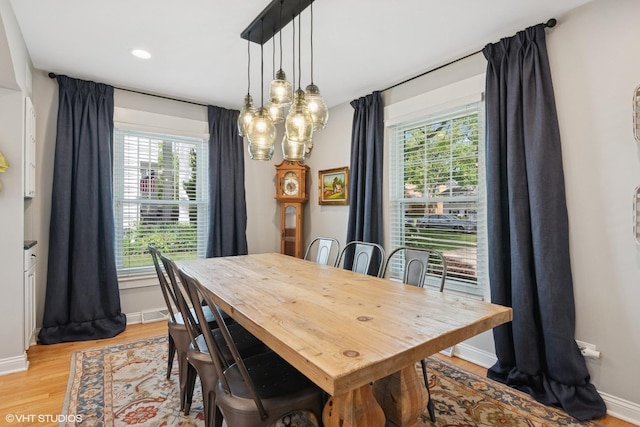 1702 Madsen Ct, Wheaton, IL 60187 - dining area with light wood-style floors and baseboards