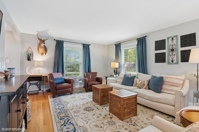 1702 Madsen Ct, Wheaton, IL 60187 - living area featuring light wood finished floors and arched walkways
