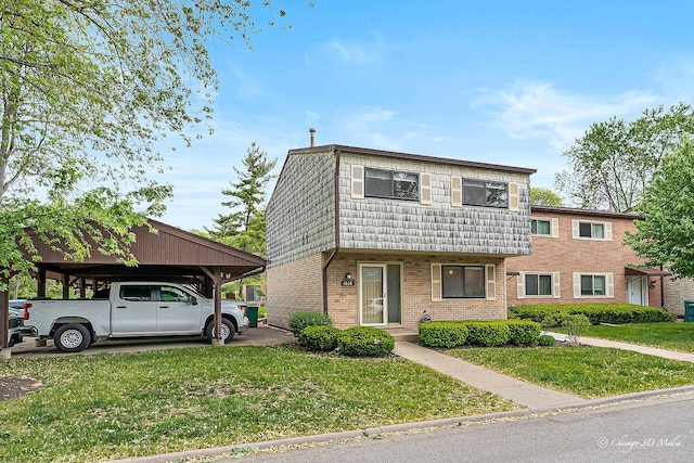 1610 Chippewa Trl, Wheeling, IL 60090 - townhome / multi-family property with a front lawn and brick siding