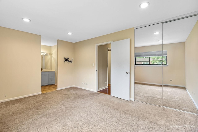 1610 Chippewa Trl, Wheeling, IL 60090 - unfurnished bedroom with carpet floors, a closet, baseboards, recessed lighting, and connected bathroom
