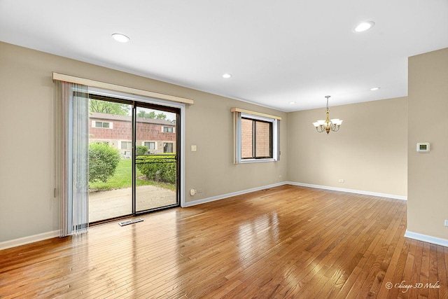1610 Chippewa Trl, Wheeling, IL 60090 - spare room featuring a chandelier, light wood-style flooring, baseboards, and recessed lighting