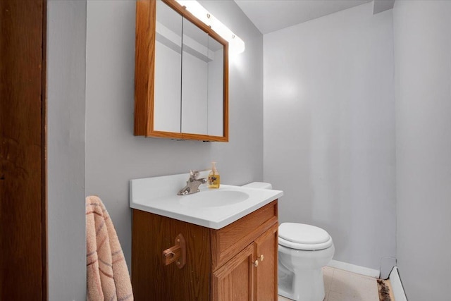 337 E Rose St, Glenwood, IL 60425 - bathroom with toilet, vanity, and baseboards