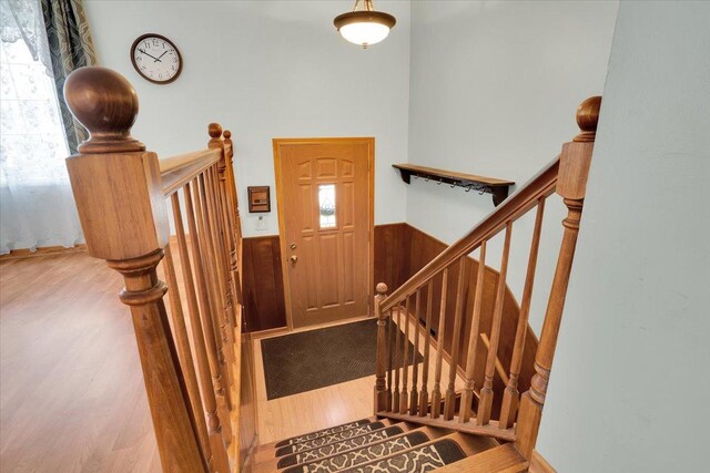 337 E Rose St, Glenwood, IL 60425 - foyer with wood finished floors, a wainscoted wall, and stairway