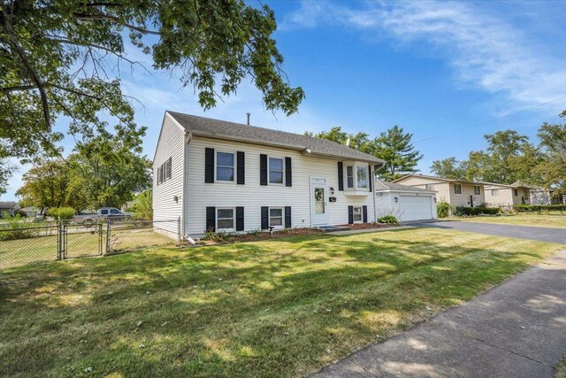 337 E Rose St, Glenwood, IL 60425 - split foyer home with a gate, driveway, and a detached garage