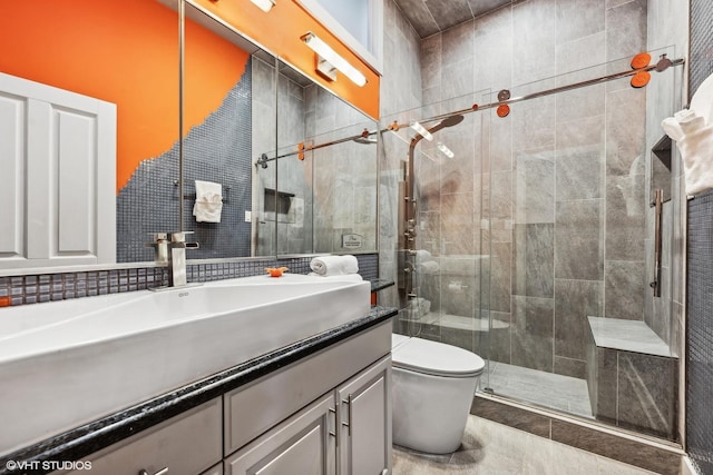 69 E Cedar St, Chicago, IL 60611 - full bath featuring a shower stall, vanity, toilet, and tile walls